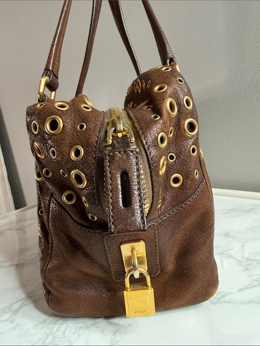 Prada Dark Brown Leather Grommet Satchel with Gold Hardware